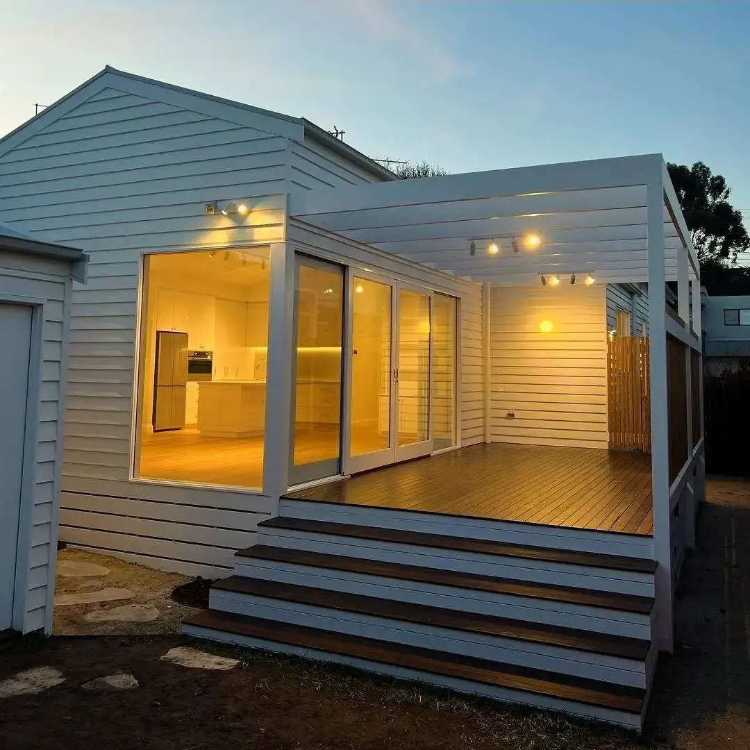 Modern residential extension with warm outdoor lighting installed by a Residential Electrician Geelong.